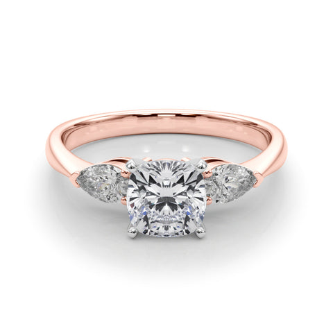 Rose gold Three-Stone Cushion Diamond Ring with Pear Side Stones on a Platinum Band with Four-Prong Setting
