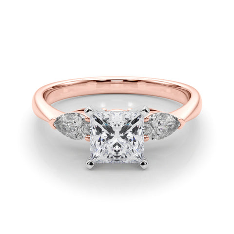 Rose gold Three-Stone Princess Diamond Ring with Pear Side Stones on a Platinum Band with Four-Prong Setting