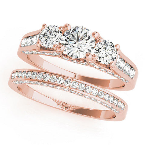 Rose gold Three-Stone Round Cut Diamond Ring with Channel-Set Band and Four-Prong Setting