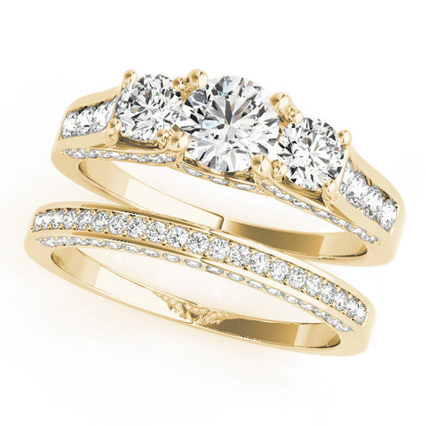 Yellow gold Three-Stone Round Cut Diamond Ring with Channel-Set Band and Four-Prong Setting