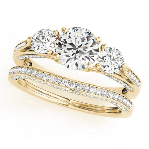 Yellow gold Round Brilliant Three-Stone Engagement Ring with Split Shank and Prong Setting