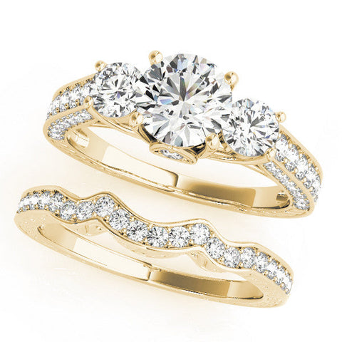 Yellow gold Three-Stone Round Cut Diamond Engagement Ring with Split Shank and Prong Setting