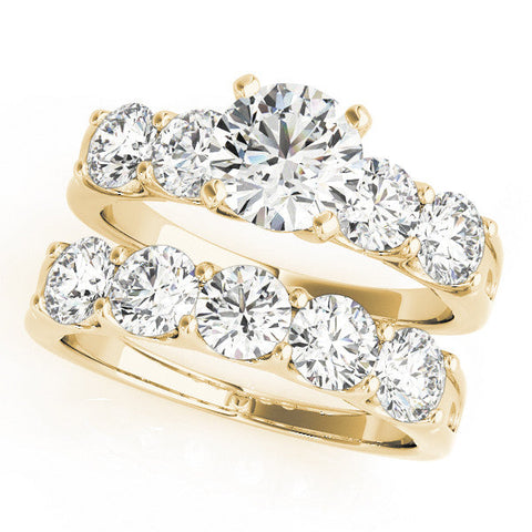 Yellow gold Heart Brilliant Diamond Five-Stone Engagement Ring with Prong Setting on a Classic Band