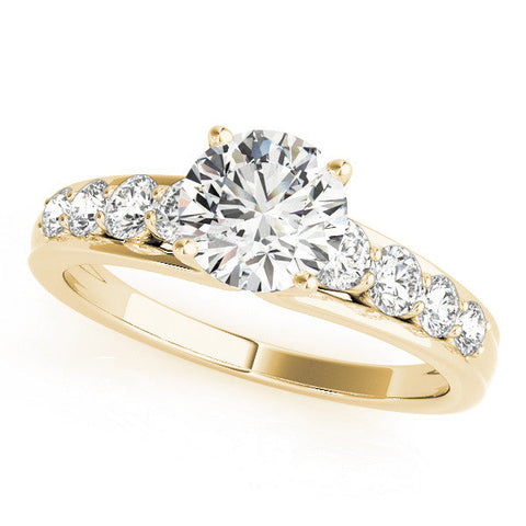 Yellow gold Princess Brilliant Solitaire with Side Stones on a Pave Band and Four-Prong Setting