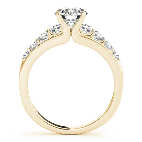 Yellow gold Princess Brilliant Solitaire with Side Stones on a Pave Band and Four-Prong Setting