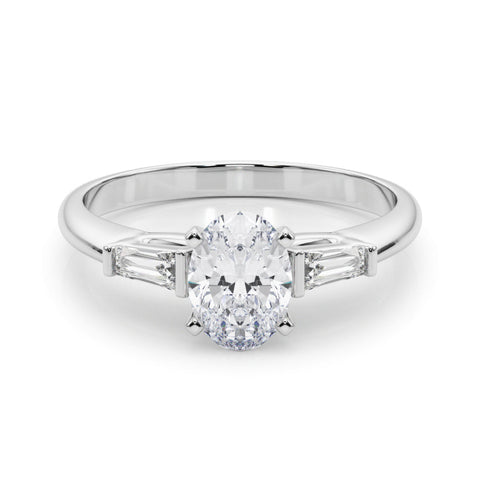 White gold Oval Solitaire with Tapered Baguette Side Stones on a Classic Band with Four-Prong Setting