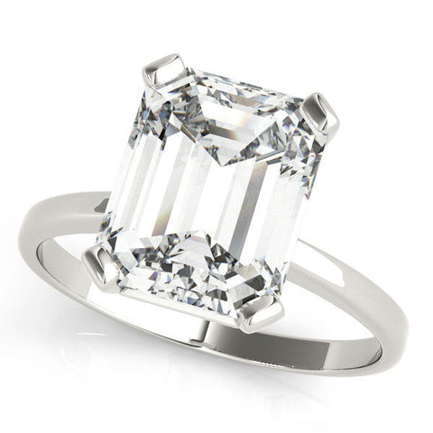 Platinum Emerald Cut Solitaire Ring with Four-Prong Setting and Classic Band