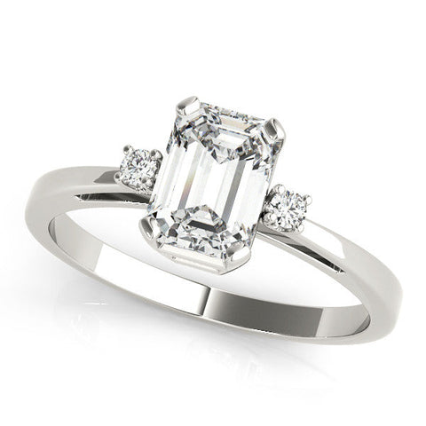 Platinum Emerald Cut Three-Stone Solitaire Ring with Round Accent Diamonds and Four-Prong Setting