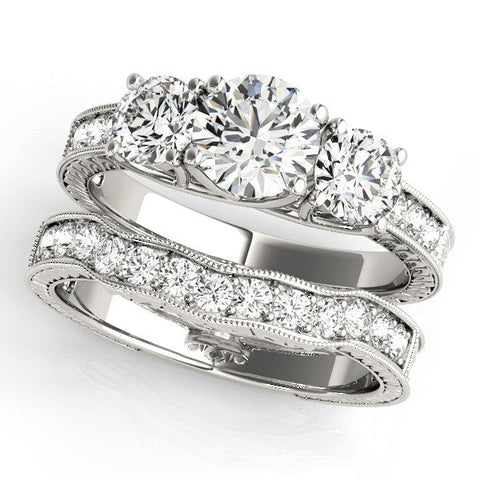 Platinum Three-Stone Round Cut Pavé Band with Prong Setting
