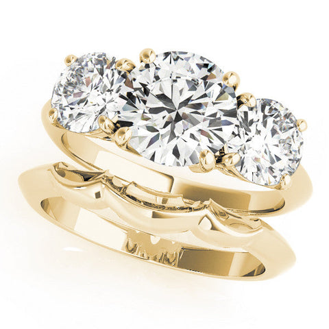 Yellow gold Three-Stone Round Cut Diamond Engagement Ring with Prong Setting on a White Gold Band