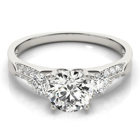 Platinum Round Brilliant Three-Stone Diamond Ring with Pavé Band and Four-Prong Setting