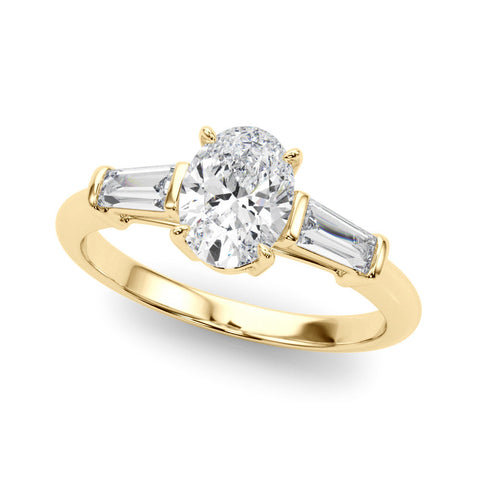 Yellow gold Oval Cut Diamond Ring with Tapered Baguette Side Stones on a Platinum Band with Four-Prong Setting