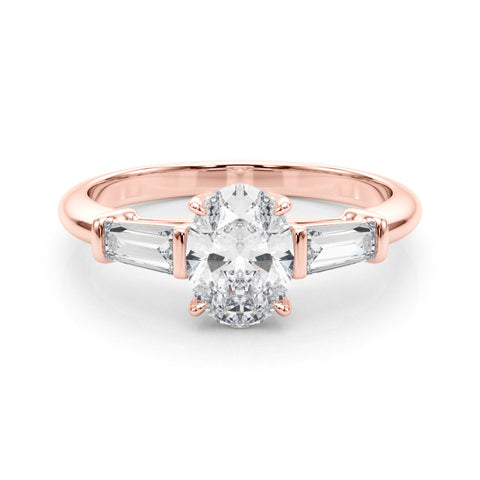 Rose gold Oval Cut Diamond Ring with Tapered Baguette Side Stones on a Platinum Band with Four-Prong Setting