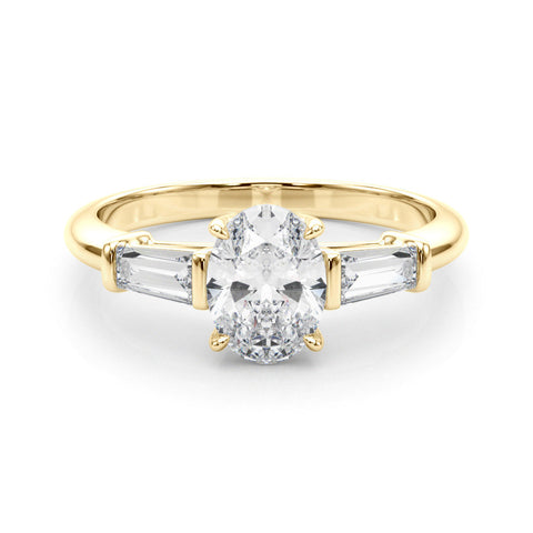 Yellow gold Oval Cut Diamond Ring with Tapered Baguette Side Stones on a Platinum Band with Four-Prong Setting