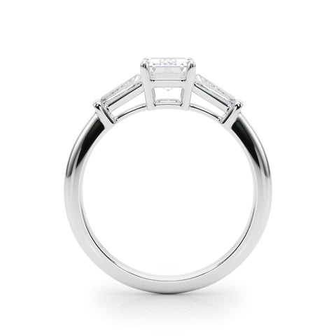Platinum Round Cut Diamond Ring with Tapered Baguette Side Stones on a Platinum Band with Four-Prong Setting