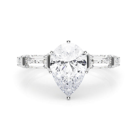Platinum Pear Cut Diamond Ring with Baguette Side Stones, Channel Set Band, and Four-Prong Setting