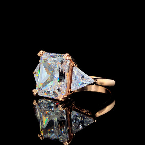 Three-Stone Radiant Cut Diamond Ring with Trillion Side Stones and Rose Gold Band