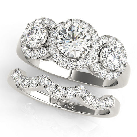 Platinum Three-Stone Round Halo Diamond Ring with Pavé Band and Four-Prong Setting