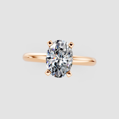Rose gold Oval Cut Solitaire Engagement Ring with Round Band and Four-Prong Setting