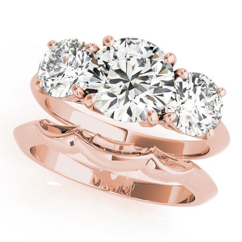 Rose gold Three-Stone Round Cut Diamond Engagement Ring with Prong Setting on a White Gold Band
