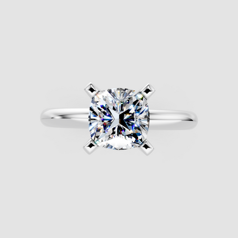 Platinum Cushion Cut Solitaire Engagement Ring with Round Band and Four-Prong Setting