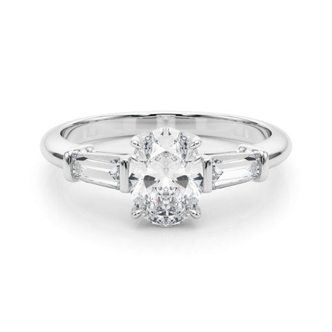 Platinum Oval Cut Diamond Ring with Tapered Baguette Side Stones in Four-Prong Setting