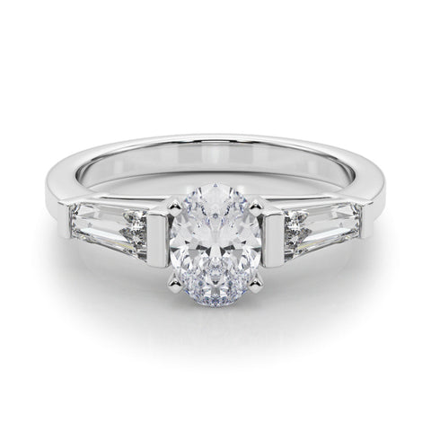 Platinum Oval Cut Diamond Solitaire Ring with Tapered Baguette Accents and Four-Prong Setting
