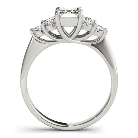 Platinum Emerald Cut Diamond Cluster Ring with Round Accent Stones and Prong Setting on a Classic Band