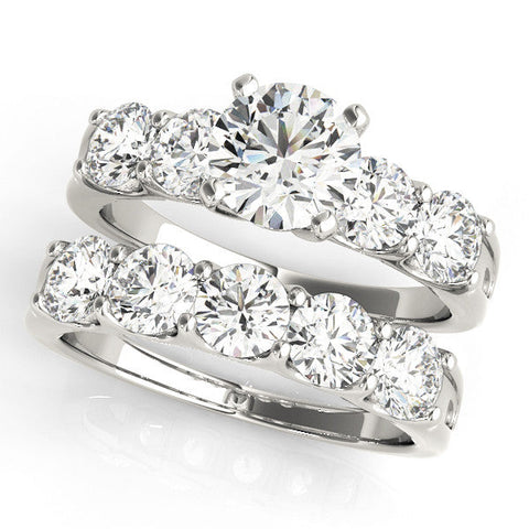 Platinum Round Brilliant Diamond Five-Stone Engagement Ring with Prong Setting on a Classic Band