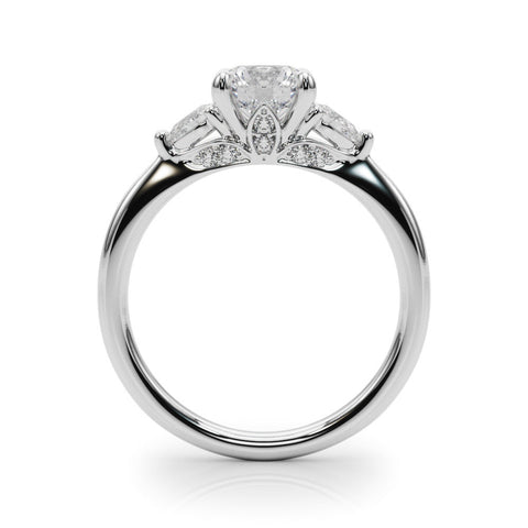 Platinum Round Brilliant Three-Stone Ring with Pear Side Stones and Four-Prong Setting