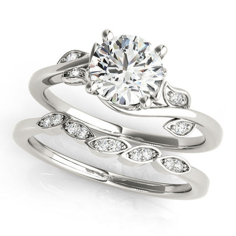 Platinum Round Solitaire Twist Engagement Ring with Leaf Accents and Prong Setting