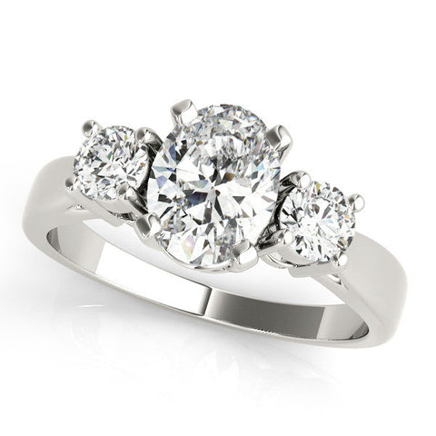 Platinum Three-Stone Oval Diamond Ring with Round Side Stones, Classic Band, and Four-Prong Setting