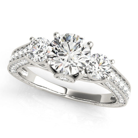 Platinum Three-Stone Round Cut Diamond Engagement Ring with Split Shank and Prong Setting