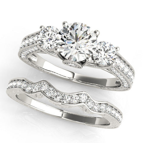 Platinum Three-Stone Round Cut Diamond Engagement Ring with Split Shank and Prong Setting