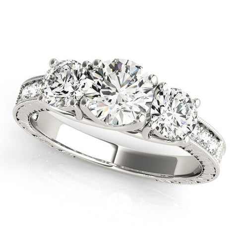 Platinum Three-Stone Round Cut Pavé Band with Prong Setting