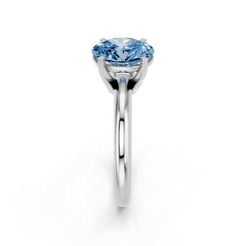 White gold Fancy Blue Oval  Cut Solitaire Engagement Ring with Round Band and Four-Prong Setting