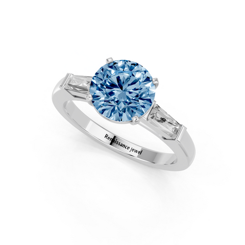 White gold Fancy Blue Round  Solitaire with Tapered Baguette Side Stones on a Classic Band with Four-Prong Setting