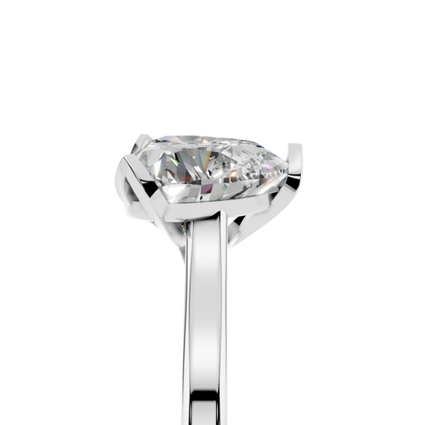 Platinum Heart Cut Solitaire Diamond Ring with Flower-Prong Setting and Classic Band