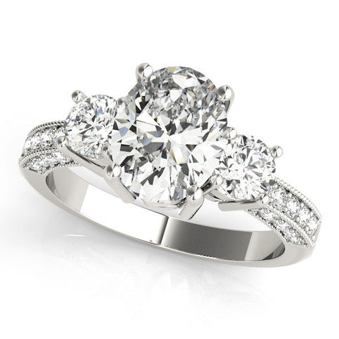 Platinum Oval Three-Stone Diamond Ring with Pavé Band and Four-Prong Setting