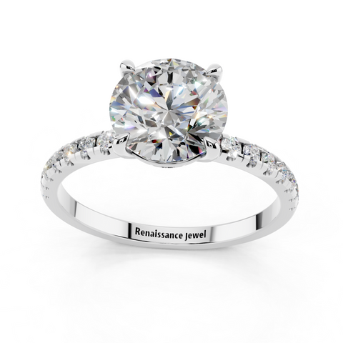 White gold Round Brilliant Solitaire with Pavé Band and Four-Prong Setting