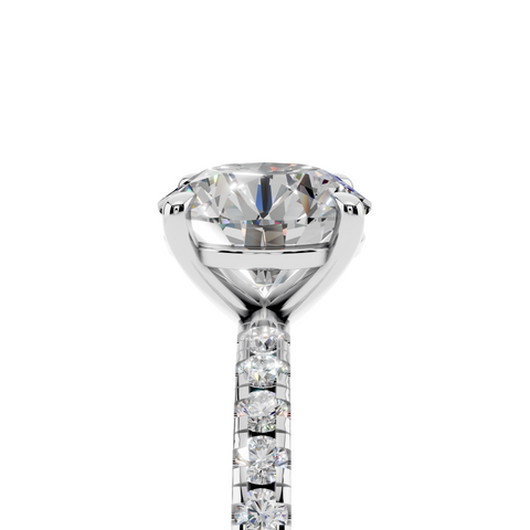 White gold Round Brilliant Solitaire with Pavé Band and Four-Prong Setting
