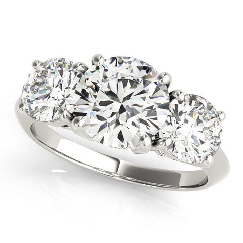 Platinum Three-Stone Round Cut Diamond Engagement Ring with Prong Setting on a White Gold Band