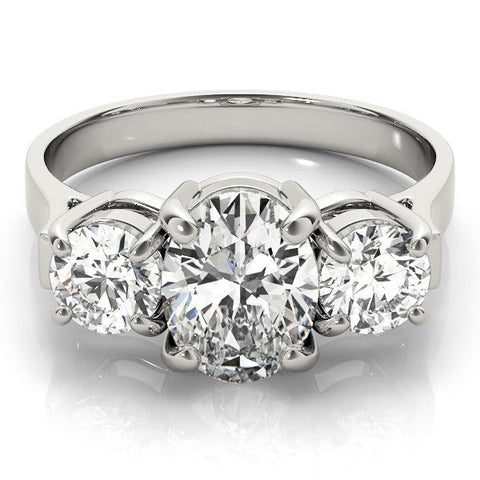 Platinum Three-Stone Oval Cut Diamond Ring with Round Accent Stones, Prong Setting, and Classic Band