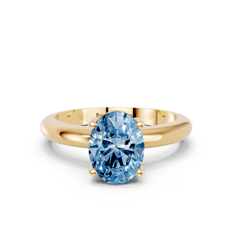 Yellow gold Fancy Blue Oval  Cut Solitaire Engagement Ring with Round Band and Four-Prong Setting