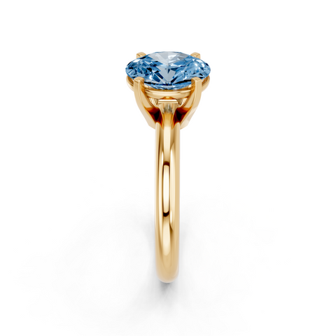 Yellow gold Fancy Blue Oval  Cut Solitaire Engagement Ring with Round Band and Four-Prong Setting