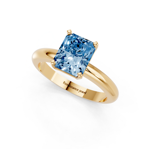 Yellow gold Fancy Blue Radiant  Cut Solitaire Engagement Ring with Round Band and Four-Prong Setting