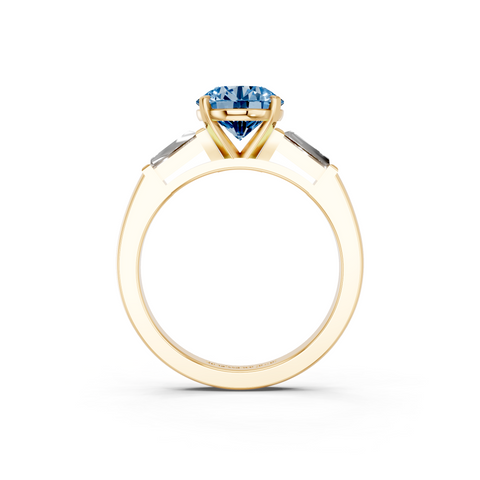 Yellow gold Fancy Blue Round  Solitaire with Tapered Baguette Side Stones on a Classic Band with Four-Prong Setting