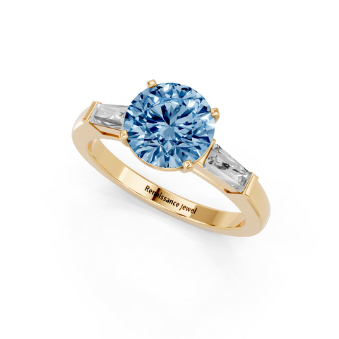 Yellow gold Fancy Blue Round  Solitaire with Tapered Baguette Side Stones on a Classic Band with Four-Prong Setting