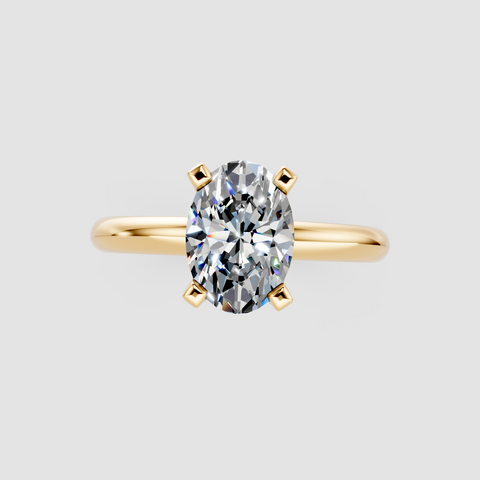 Yellow gold Oval Cut Solitaire Engagement Ring with Round Band and Four-Prong Setting