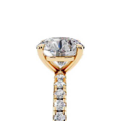 Yellow gold Round Brilliant Solitaire with Pavé Band and Four-Prong Setting